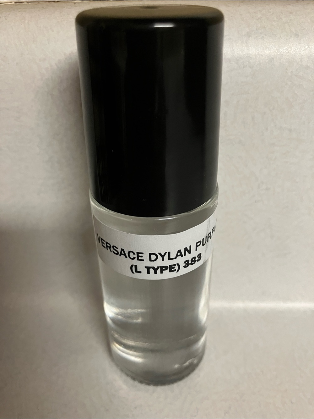 Versace Dylan Purple 1 oz. rollerball perfume.